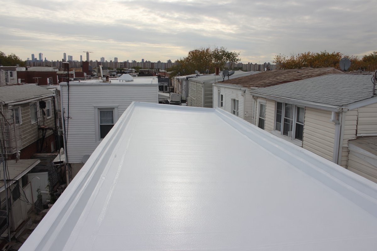 After: new TPO roof on a Jamaica home, clean welded seams