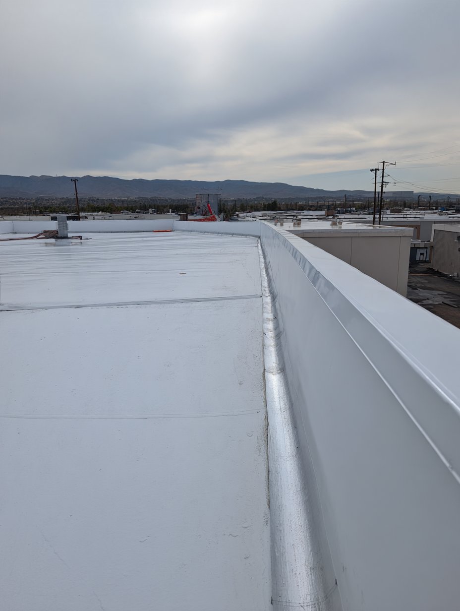 Welded TPO seams on the new roof of a mixed-use building in Corona